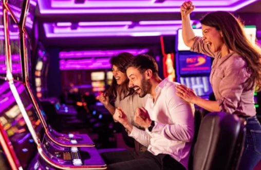 Filipino player using iq77 mobile app for sports betting and casino games on smartphone